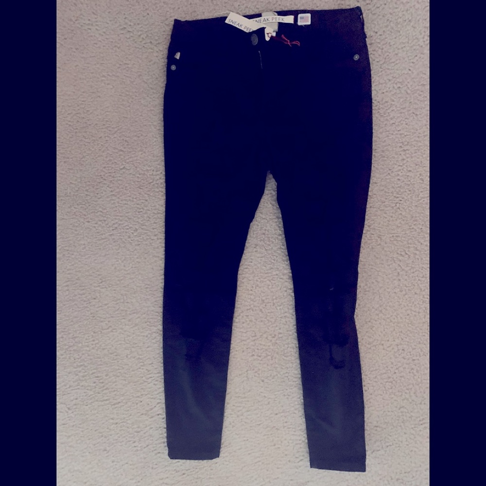 Brand new black holed jeans.